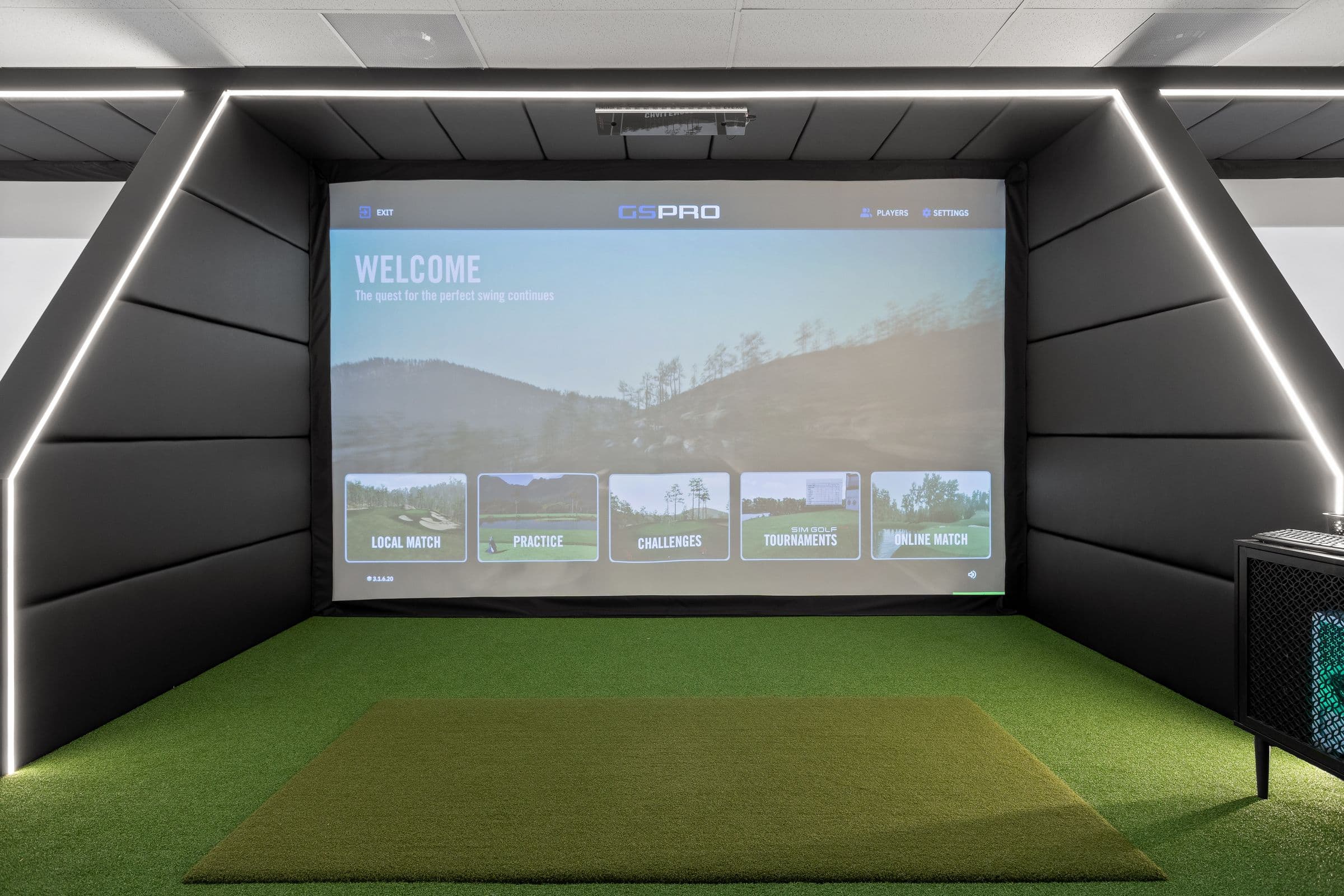 Simulator bay from the hitting mat, facing the GSPro screen