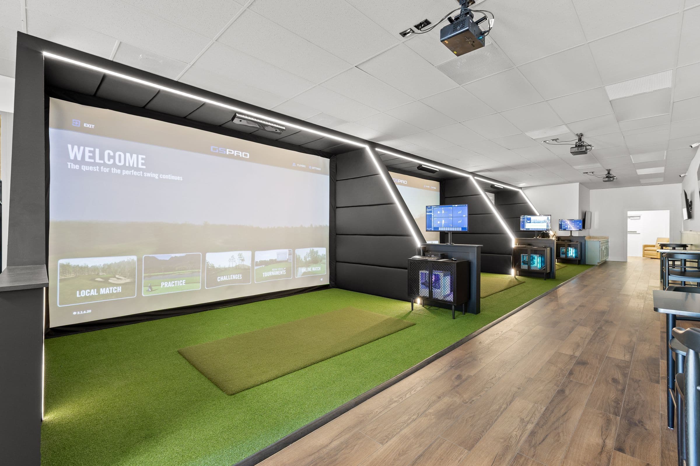 Row of Launch Lab simulator bays with LED-lit enclosures