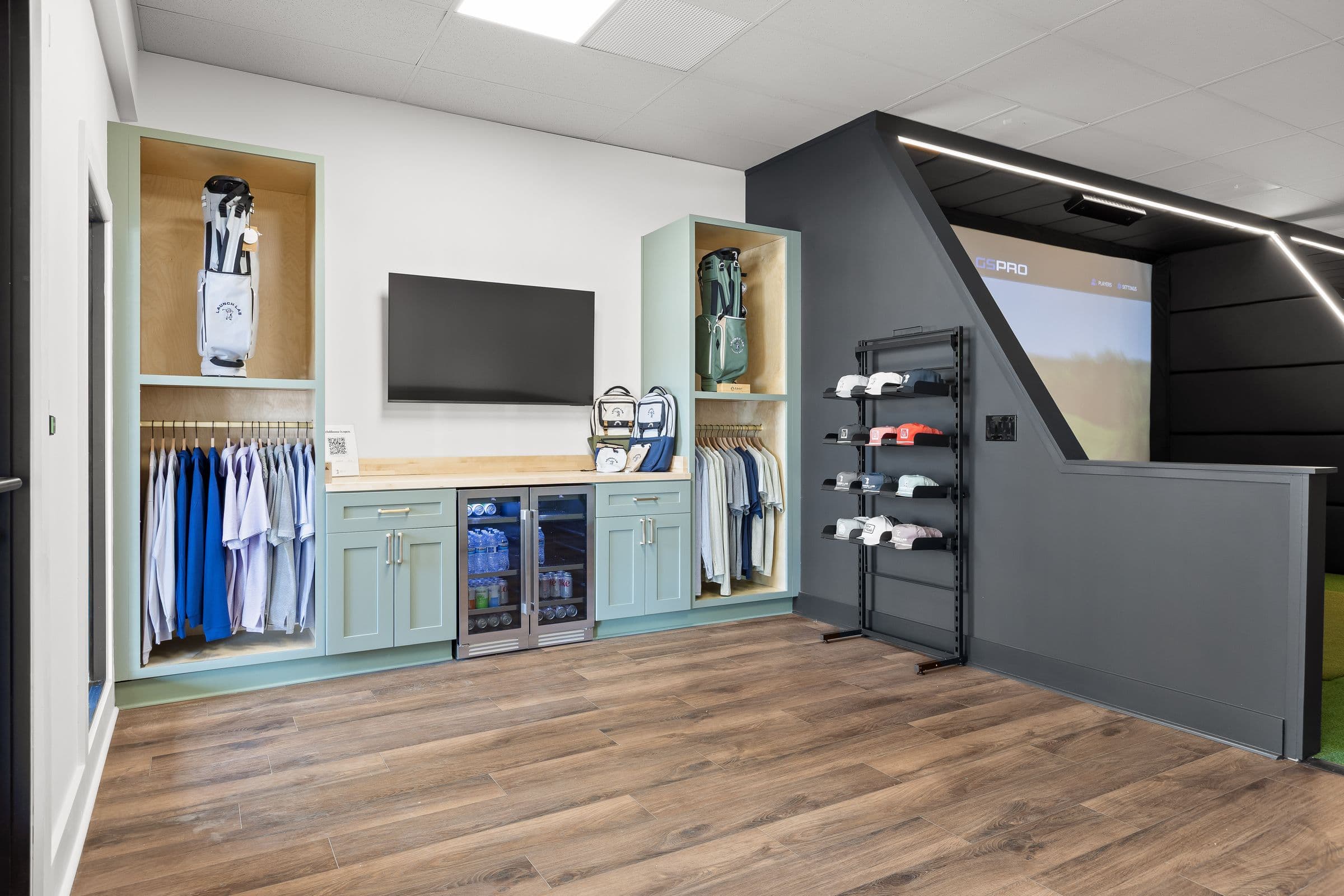 Pro shop with apparel, bags, and a drinks fridge